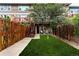 Charming backyard with a lush lawn and privacy fence, creating a serene outdoor retreat at 19 S Harrison St, Denver, CO 80209
