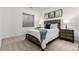 Bedroom with large window features bedside tables, a comfy bed and carpeted floors at 19 S Harrison St, Denver, CO 80209