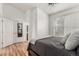 Bedroom with hardwood floors, natural light and attached bathroom at 19 S Harrison St, Denver, CO 80209