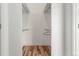 Bright closet featuring hardwood floors and white walls at 19 S Harrison St, Denver, CO 80209