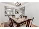 Bright dining area with a table, hardwood floors, and adjacent view to the kitchen at 19 S Harrison St, Denver, CO 80209