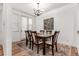 Elegant dining room with a stylish table, hardwood floors, and ample natural light at 19 S Harrison St, Denver, CO 80209