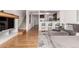 Open concept living area with hardwood floors seamlessly flows into the kitchen at 19 S Harrison St, Denver, CO 80209