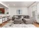 Bright living room with plush seating, hardwood floors, and natural light from the large windows at 19 S Harrison St, Denver, CO 80209