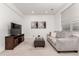 Relaxing living room features plush sofa, ottoman, and neutral carpet at 19 S Harrison St, Denver, CO 80209