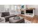 Cozy living area features a fireplace, hardwood floors, and neutral decor at 19 S Harrison St, Denver, CO 80209