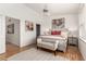 Bright bedroom featuring hard wood floors, a ceiling fan, and large windows at 19 S Harrison St, Denver, CO 80209