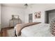 Bedroom featuring a double bed, a bedside table, and a dresser with a mirror at 19 S Harrison St, Denver, CO 80209