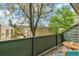 Balcony view with green trees and wooden rail in residential neighborhood at 1842 Canyon Blvd # 209, Boulder, CO 80302