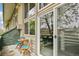 Outdoor balcony with seating overlooks living room with spiral staircase at 1842 Canyon Blvd # 209, Boulder, CO 80302