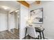 Hallway featuring modern decor, wood floors, and mirrored closet at 1842 Canyon Blvd # 209, Boulder, CO 80302
