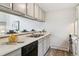Kitchen view showing dishwasher and nearby breakfast bar at 1842 Canyon Blvd # 209, Boulder, CO 80302