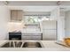 Kitchen view featuring appliances and a bright window at 1842 Canyon Blvd # 209, Boulder, CO 80302
