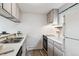 Functional kitchen features modern appliances, bright countertops, and ample storage space at 1842 Canyon Blvd # 209, Boulder, CO 80302