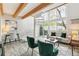 Sun-filled living room featuring a spiral staircase and large windows at 1842 Canyon Blvd # 209, Boulder, CO 80302