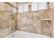 Detailed view of the shower with brown tile and two windows at 1842 Canyon Blvd # 209, Boulder, CO 80302