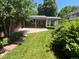 Charming backyard with stone patio and lush green lawn at 701 S Clayton St, Denver, CO 80209