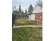 Backyard with lawn, shed, and flagstone path at 701 S Clayton St, Denver, CO 80209