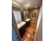 Elegant bathroom with modern double vanity and hardwood floors at 701 S Clayton St, Denver, CO 80209