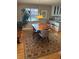 Inviting dining area with wood table, modern light fixture, and decorative rug at 701 S Clayton St, Denver, CO 80209