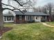 Charming single-Gathering home with beautiful lawn and white door at 701 S Clayton St, Denver, CO 80209