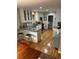Spacious kitchen with granite countertops, modern cabinetry, stainless steel appliances, and hardwood floors at 701 S Clayton St, Denver, CO 80209