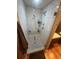 Modern shower with glass door, rain shower head, and built-in bench at 701 S Clayton St, Denver, CO 80209