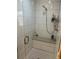 Modern shower with white tile, built-in seat, and glass enclosure at 701 S Clayton St, Denver, CO 80209