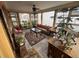 Sunroom with tiled floor, wicker furniture, and lots of natural light at 701 S Clayton St, Denver, CO 80209