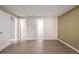 Empty bedroom with laminate floors, white trim, and neutral paint at 301 Amethyst Way, Superior, CO 80027