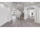 Bright entryway featuring a staircase with iron balusters and stylish gray-toned wood flooring at 301 Amethyst Way, Superior, CO 80027