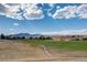 Wide-open green space with mountain views and walking paths in a vibrant community setting at 301 Amethyst Way, Superior, CO 80027