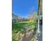 Expansive backyard featuring a well-maintained lawn, wooden fence, and partial covered patio at 13024 E Alaska Pl, Aurora, CO 80012