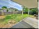 Spacious backyard with lush green lawn and mature trees perfect for outdoor activities at 13024 E Alaska Pl, Aurora, CO 80012
