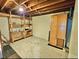 Spacious unfinished basement area with wooden shelving and storage cabinets at 13024 E Alaska Pl, Aurora, CO 80012
