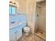 Bathroom with tiled shower, single vanity and storage at 13024 E Alaska Pl, Aurora, CO 80012