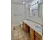 Bathroom features double vanity, tile floors and plenty of storage space at 13024 E Alaska Pl, Aurora, CO 80012