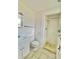 This renovated bathroom features a shower with glass doors and modern fixtures at 13024 E Alaska Pl, Aurora, CO 80012