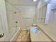 Bathroom with tiled shower and tub combination and single vanity with storage at 13024 E Alaska Pl, Aurora, CO 80012