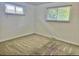 Cozy bedroom with neutral carpeting and two windows providing natural light at 13024 E Alaska Pl, Aurora, CO 80012