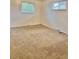 Neutral bedroom with carpeted floors and bright natural light from two windows at 13024 E Alaska Pl, Aurora, CO 80012