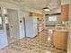 Charming kitchen featuring neutral cabinets and countertops, plus decorative tile flooring at 13024 E Alaska Pl, Aurora, CO 80012