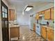 Well-lit kitchen with tile floor, white appliances and bright cabinets with plenty of storage at 13024 E Alaska Pl, Aurora, CO 80012