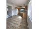 Well-lit kitchen featuring tile flooring, ample counter space, and stainless steel appliances at 13024 E Alaska Pl, Aurora, CO 80012