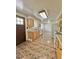 Bright kitchen featuring tile floors, wooden cabinets, and modern appliances at 13024 E Alaska Pl, Aurora, CO 80012