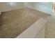 Spacious living room with neutral carpeting, light walls, and a minimalist aesthetic at 13024 E Alaska Pl, Aurora, CO 80012