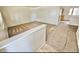 Bright living room featuring neutral carpet and ample natural light at 13024 E Alaska Pl, Aurora, CO 80012