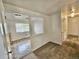 Open-concept living area with neutral walls and carpeted floors at 13024 E Alaska Pl, Aurora, CO 80012