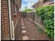 Side yard with stepping stone walkway and well maintained flower beds at 13024 E Alaska Pl, Aurora, CO 80012
