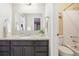 Simple bathroom with granite countertop, single sink and shower/tub at 15540 Ulster St, Thornton, CO 80602